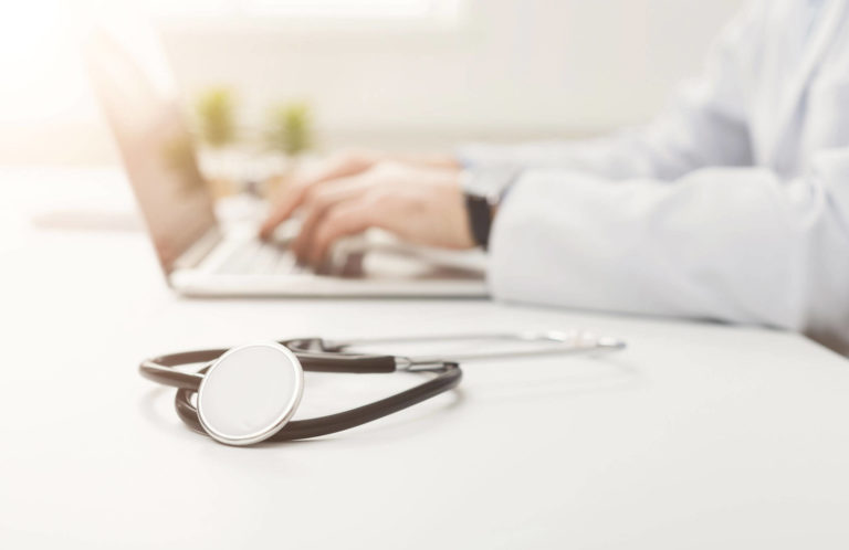 Photo of doctor at computer