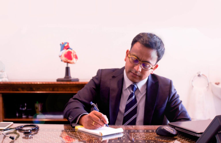 Photo of a doctor writing research